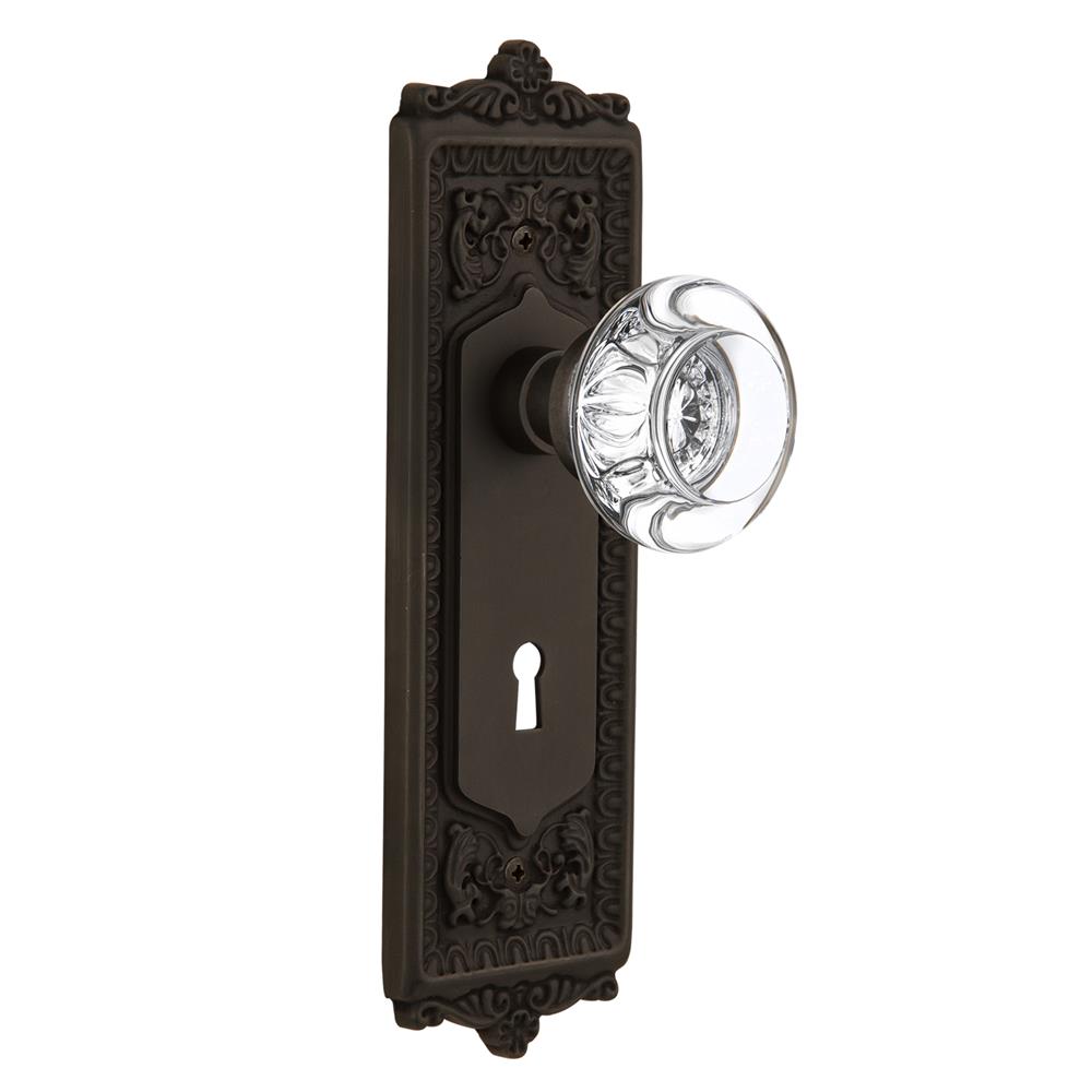 Nostalgic Warehouse EADRCC Passage Knob Egg and Dart Plate with Round Clear Crystal Knob with Keyhole in Oil Rubbed Bronze